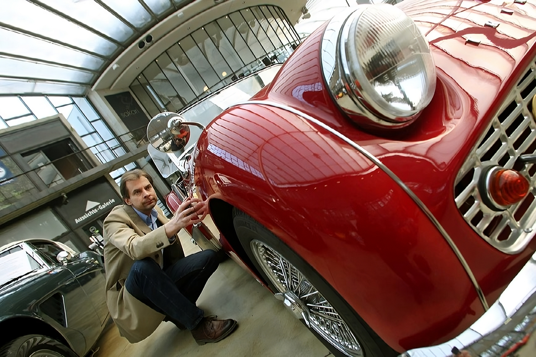 father and son repairing a car